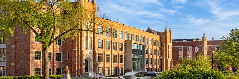 Merrifield Hall east side view with spring flowers
