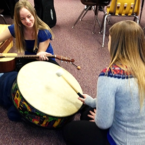 students with guitar and drum
