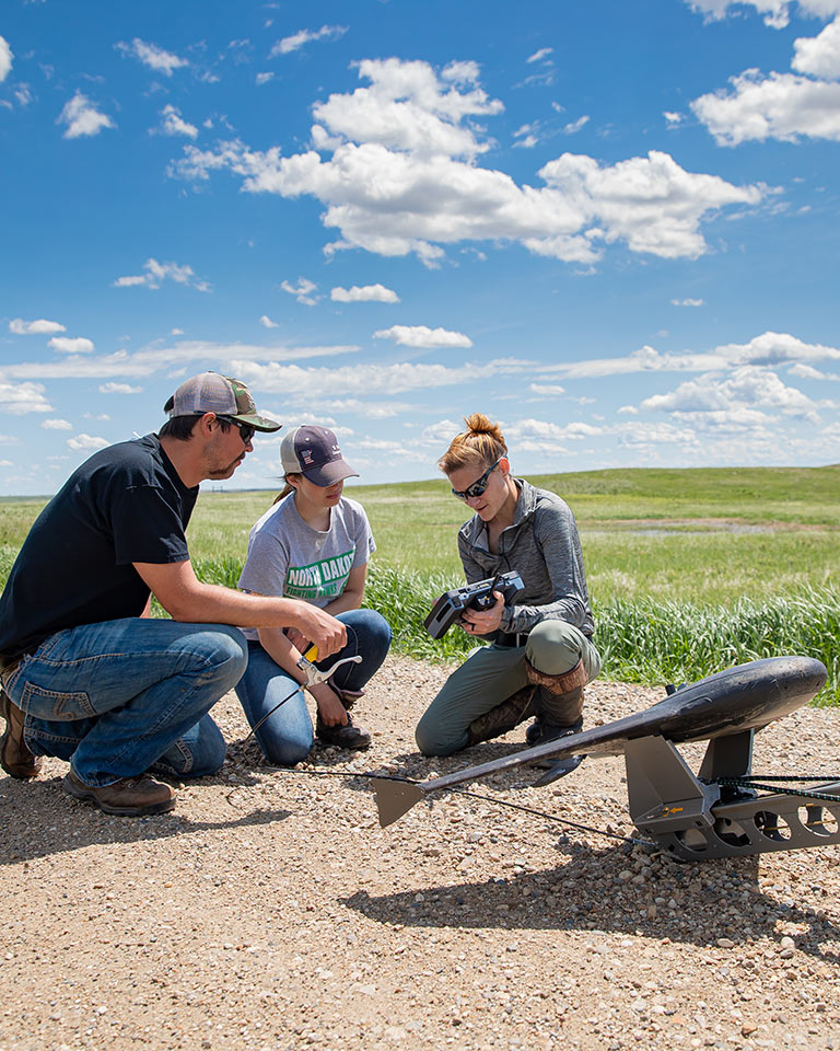 UND student field research with drone with faculty
